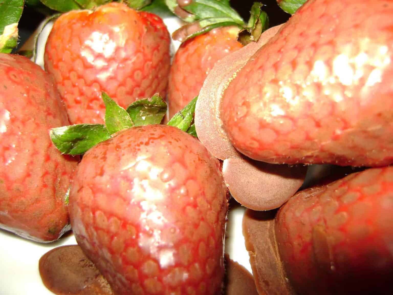 Keto chocolate covered strawberries on a plate.
