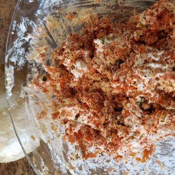 Famous Dave's Salmon Spread in a bowl on the counter next to a whole jicama.