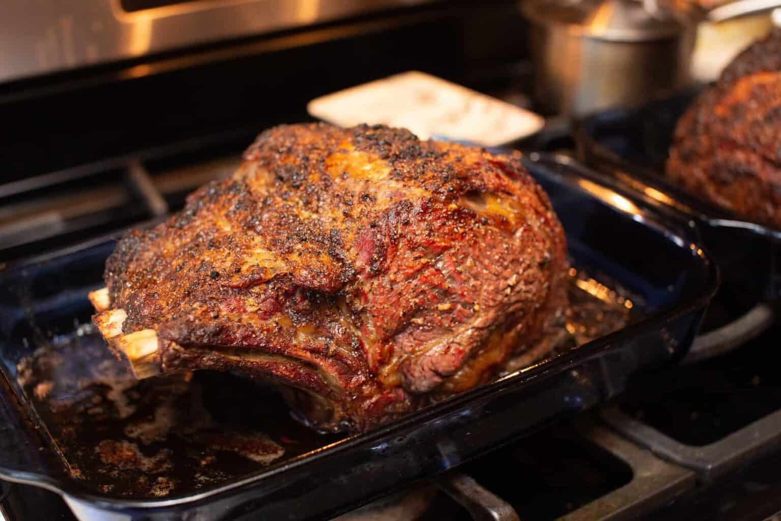 Leftover Prime Rib Recipes: Whole roasted prime rib in roasting pan on oven.
