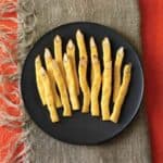 cheddar witches finger crackers on a party table