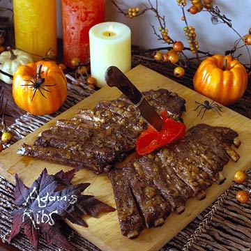 Dead Man's Halloween Ribs on cutting board on party food table