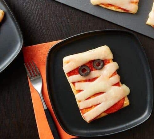 mini mummy pizzas on a plate