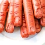 severed fingers hot dogs on a plate