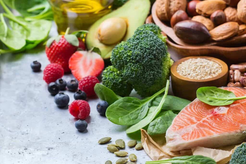 Micronutrients and macronutrients: fruit, vegetables, meats, and grains on a countertop