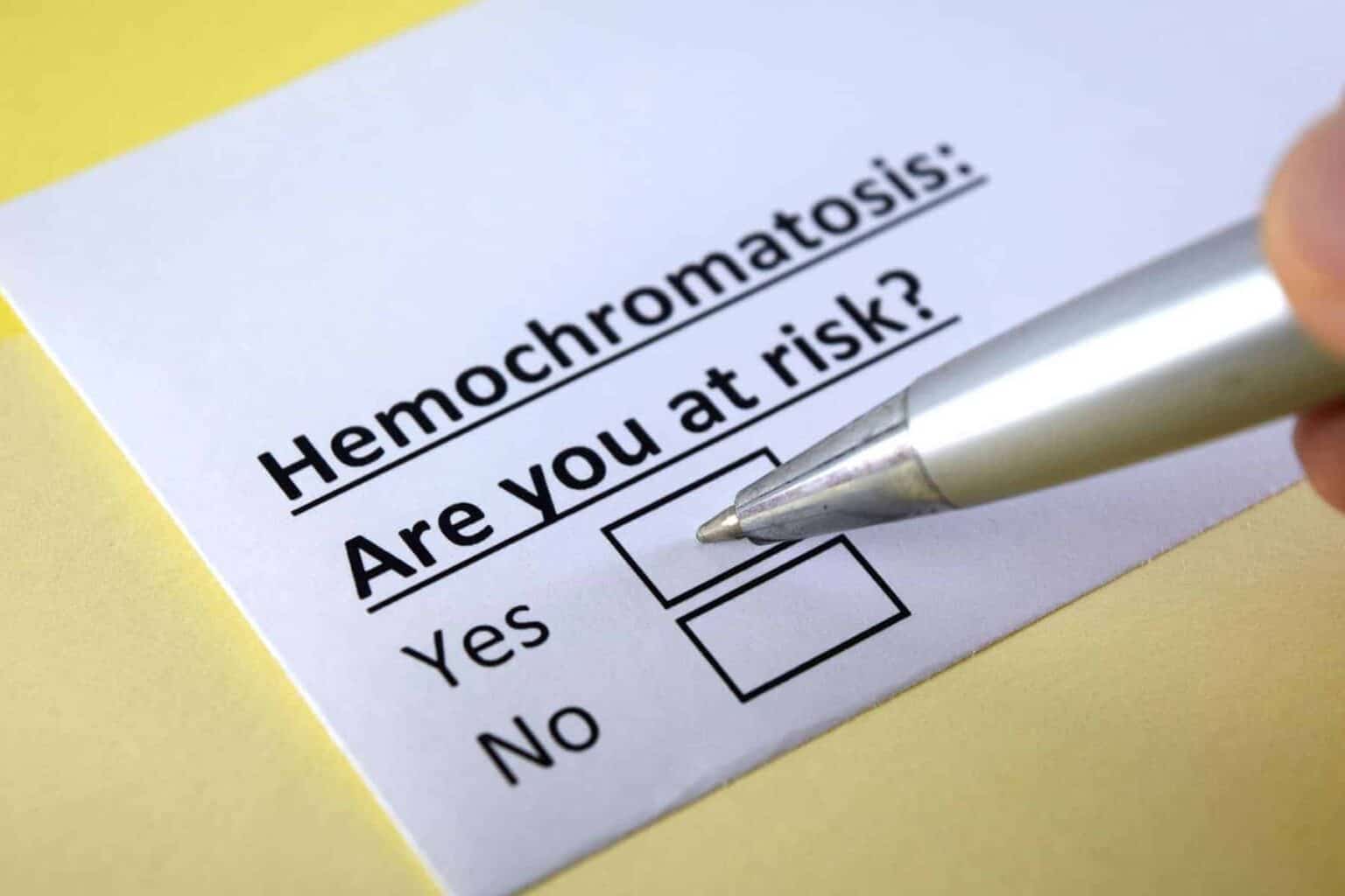 Hemochromatosis: What You Need to Know - paper with pen checking yes or no box for are you at risk