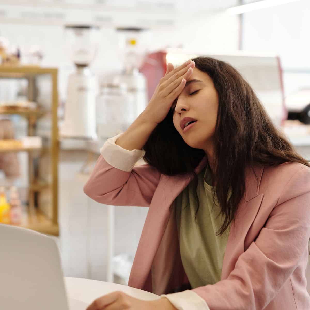 woman with computer having a hot flash